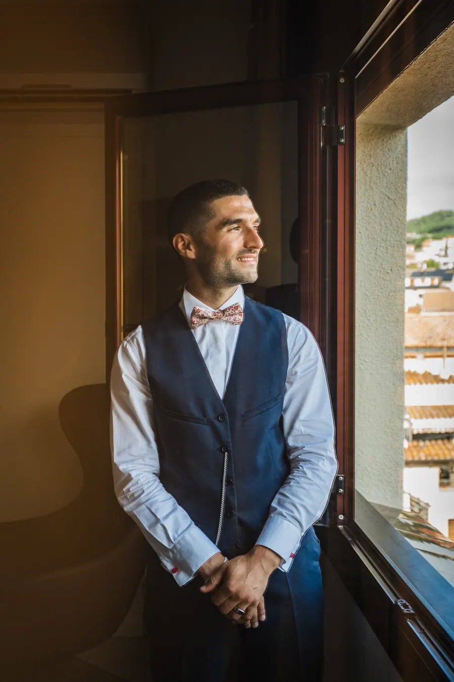 The groom waiting by the window