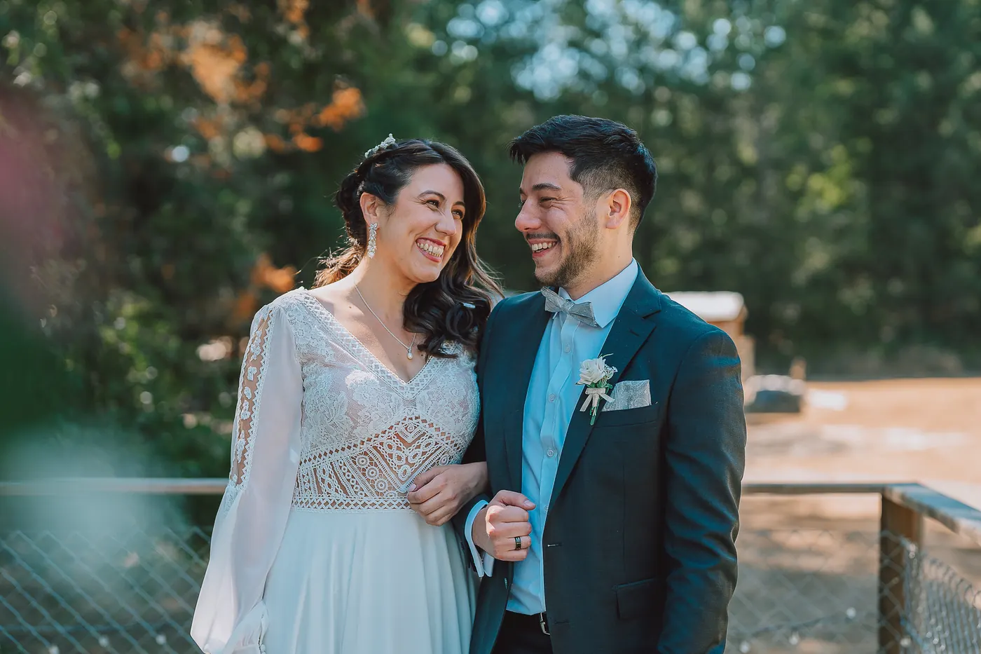 The couple laughing together in the garden